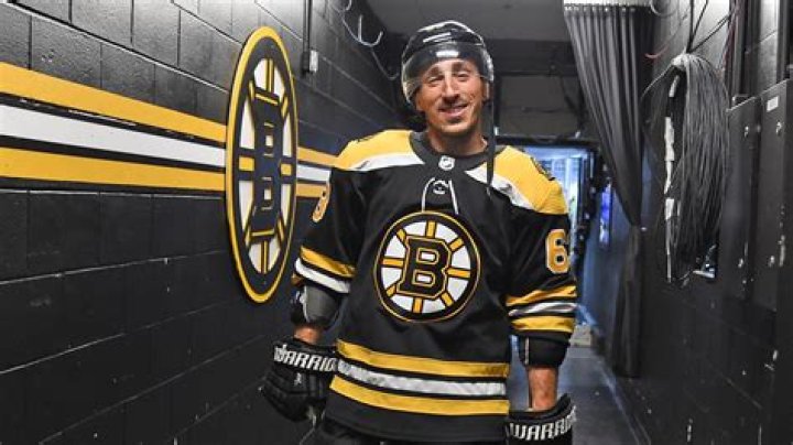 Boston Bruins&rsquo; Brad Marchand hugs his mother, Lynn and family, after