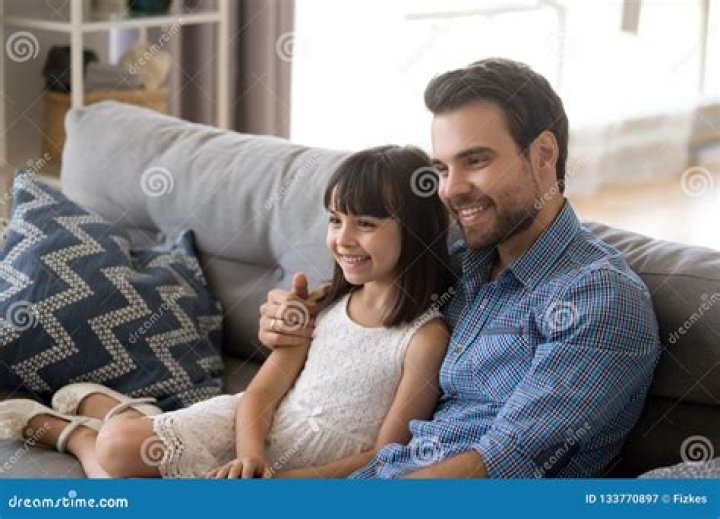 Father Embrace Daughter Sitting Together on Couch Stock Image Image