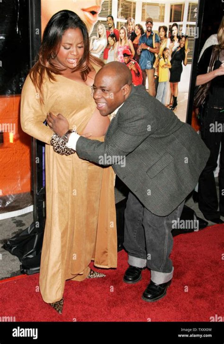 Jeff Tarpley, right, hugs his wife's belly, actress Sherri Shepherd, at