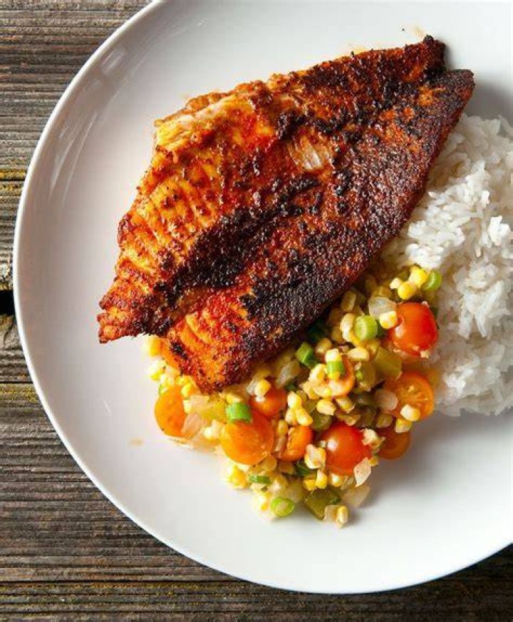 Louisiana blackened catfish, served with Cajun succotash, called maque