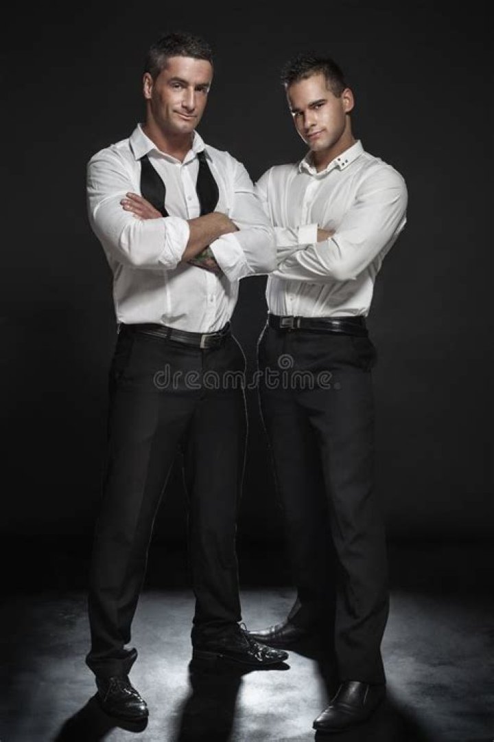two men are posing for the camera with their heads turned to look like
